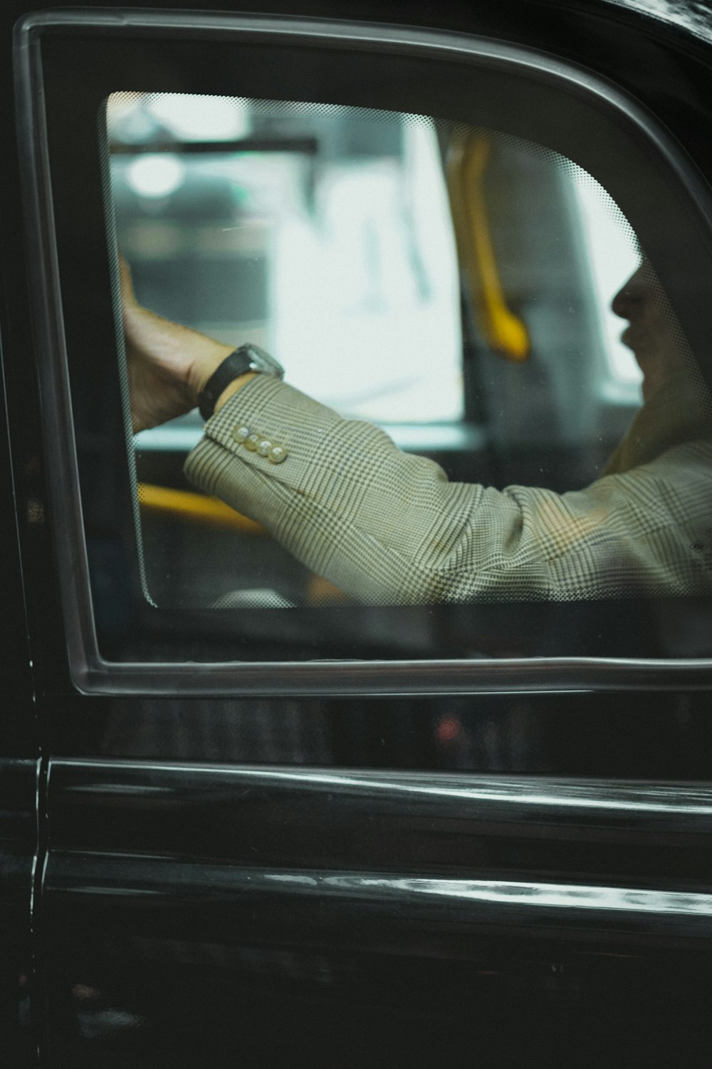 person sitting inside car