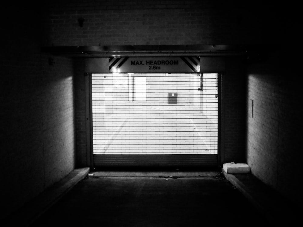grayscale photo of garage door
