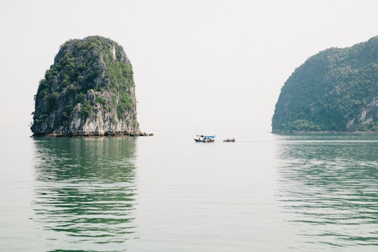 brown island surrounded by body of water in Ha Long Bay Vietnam
