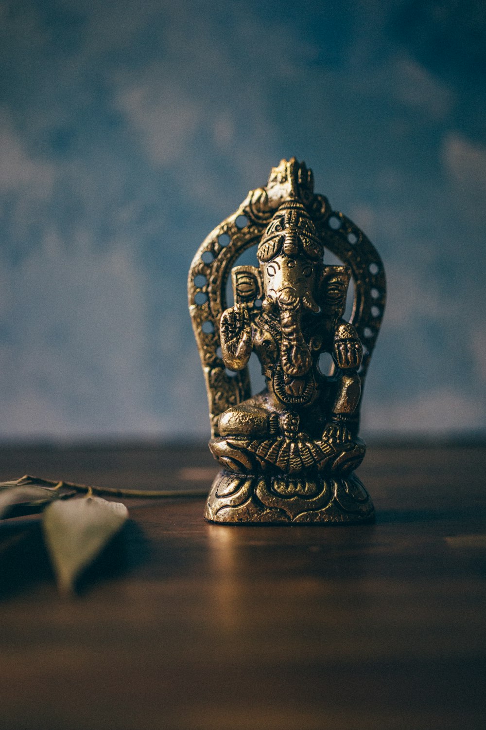 Ganesha figurine on brown surface