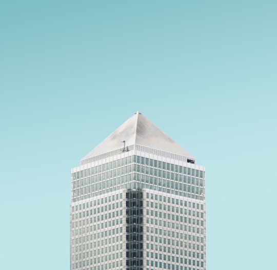 white concrete building under blue sky during daytime in Canary Wharf United Kingdom