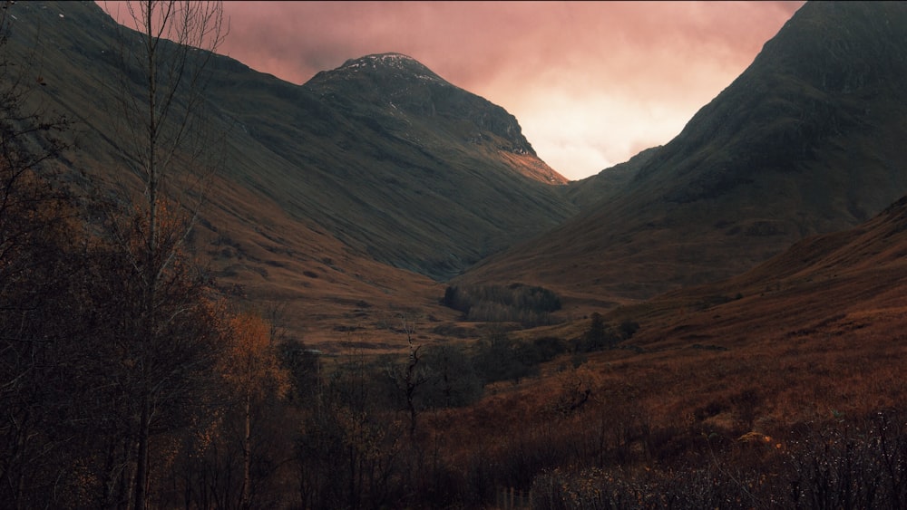 brown mountain under sunset