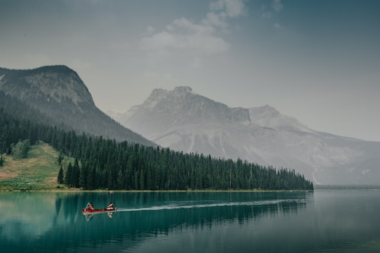 person riding on red boat in Yoho National Park Of Canada Canada