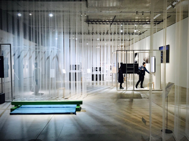 A thoughtfully arranged exhibition space curated by Sam Dicker, showcasing diverse contemporary artworks.