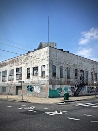 corner photo of gray concrete mid-rise building