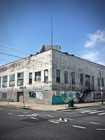 corner photo of gray concrete mid-rise building