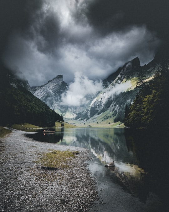 creek on snowy mountain slope in Seealpsee Switzerland