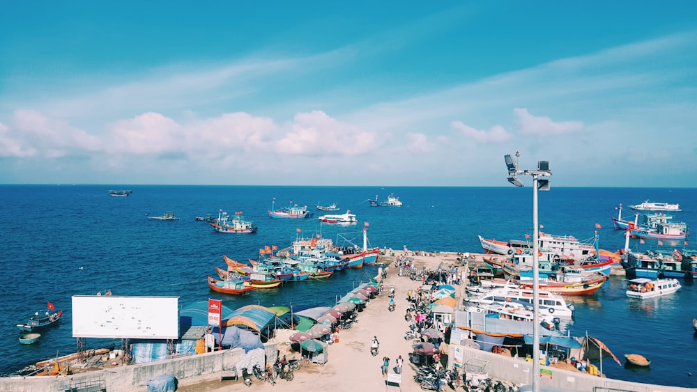 people gathering on boat dock during daytime