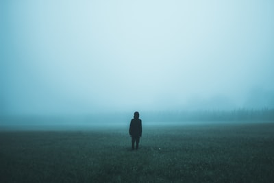 person standing on misty ground fog zoom background