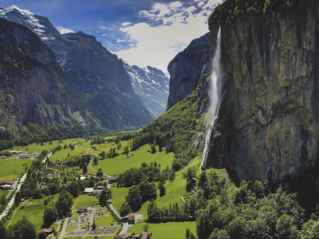 waterfalls beside grassland,