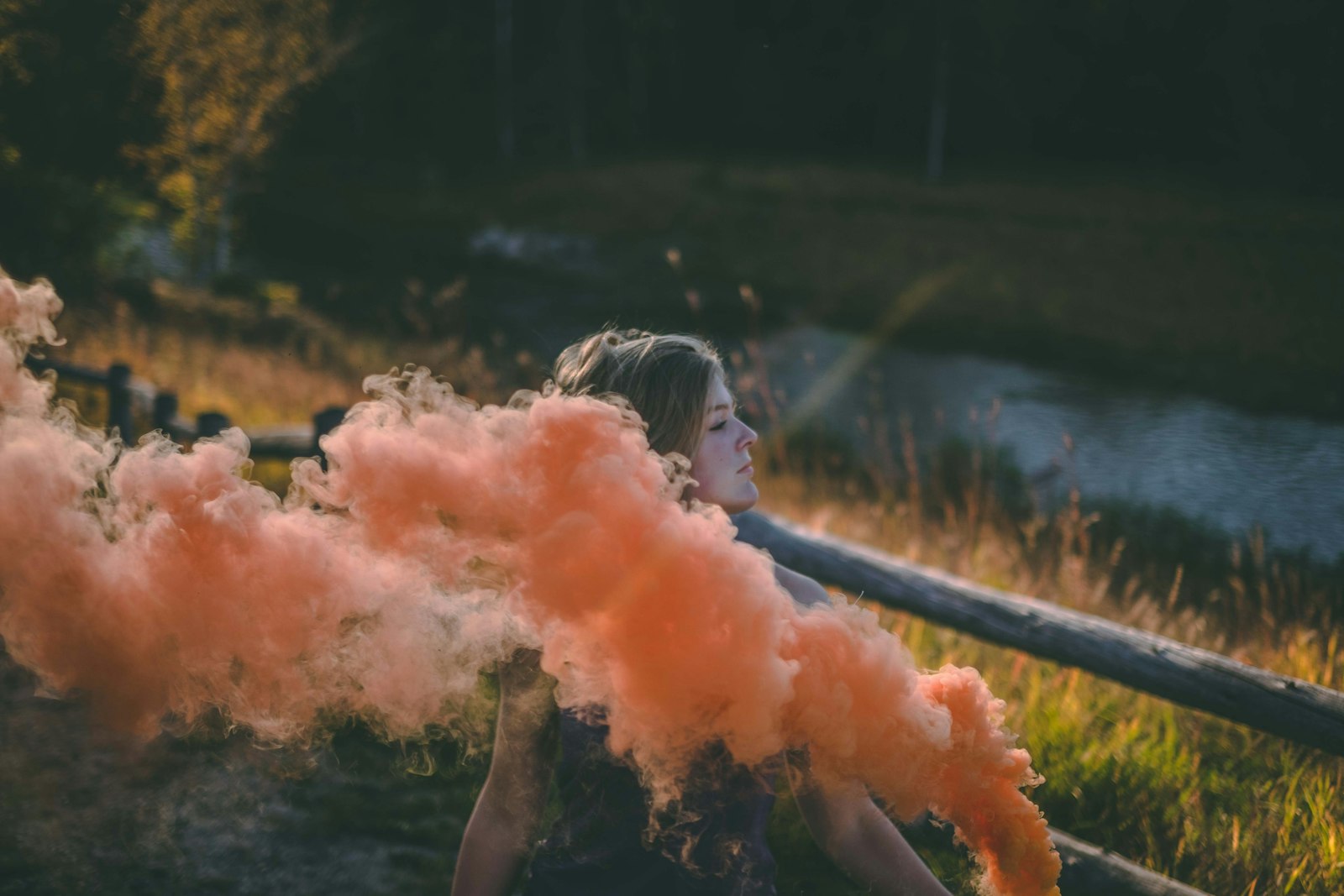 Fujifilm XF 35mm F1.4 R sample photo. Woman playing red smoke photography