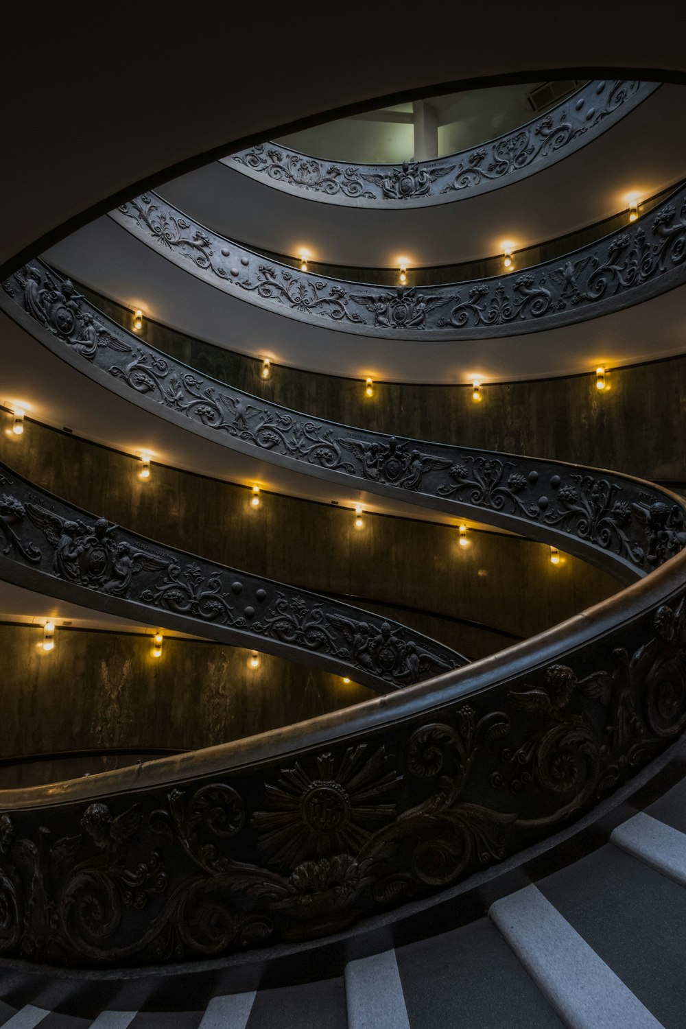 gray concrete stairway with lights