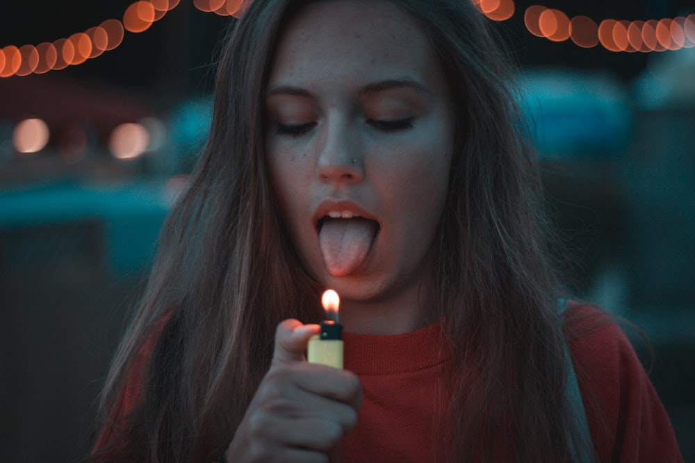 woman lighting up her tongue