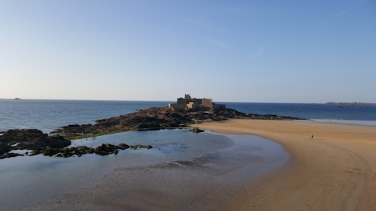 gray building on seashore at daytime in Fort National France