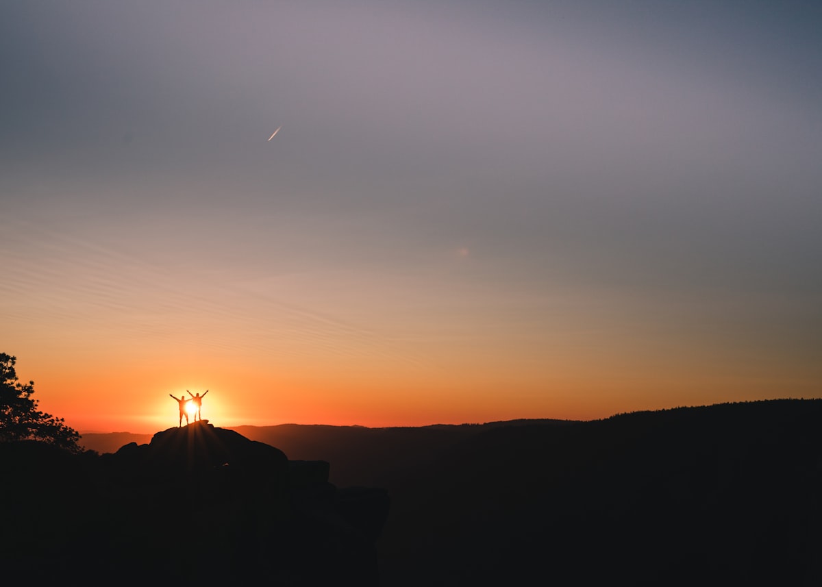 A couple hiking at sunrise