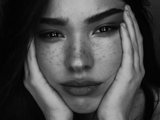 grayscale photography of woman with two hands on her face onlyfans
