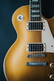 closeup photography of electric guitar, Gibson, Aivy Monroe, AI