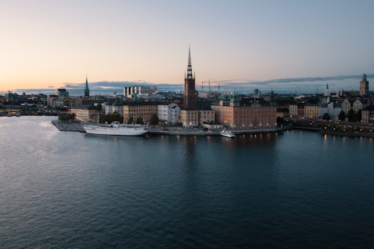 scenery of a body of water beside a city in Mariaberget Sweden