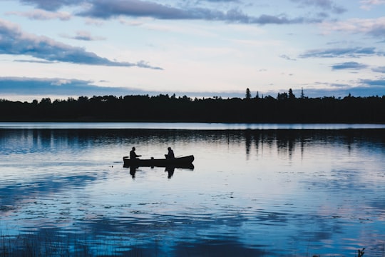 two men on kayak fishing on lake in Ontario Canada