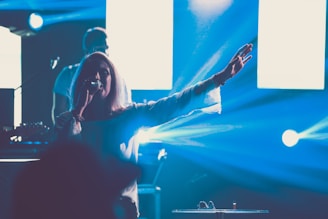 Close-up of Jhean T holding a microphone during a live concert