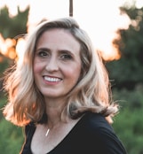 smiling woman in shallow focus photography