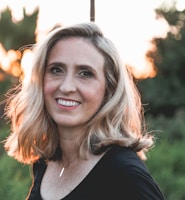 smiling woman in shallow focus photography