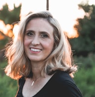 smiling woman in shallow focus photography