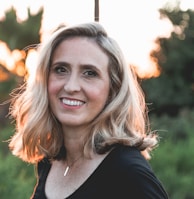 smiling woman in shallow focus photography