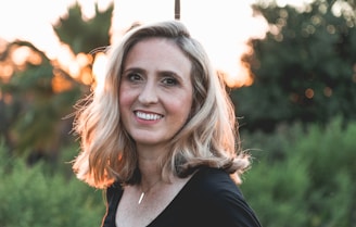 smiling woman in shallow focus photography