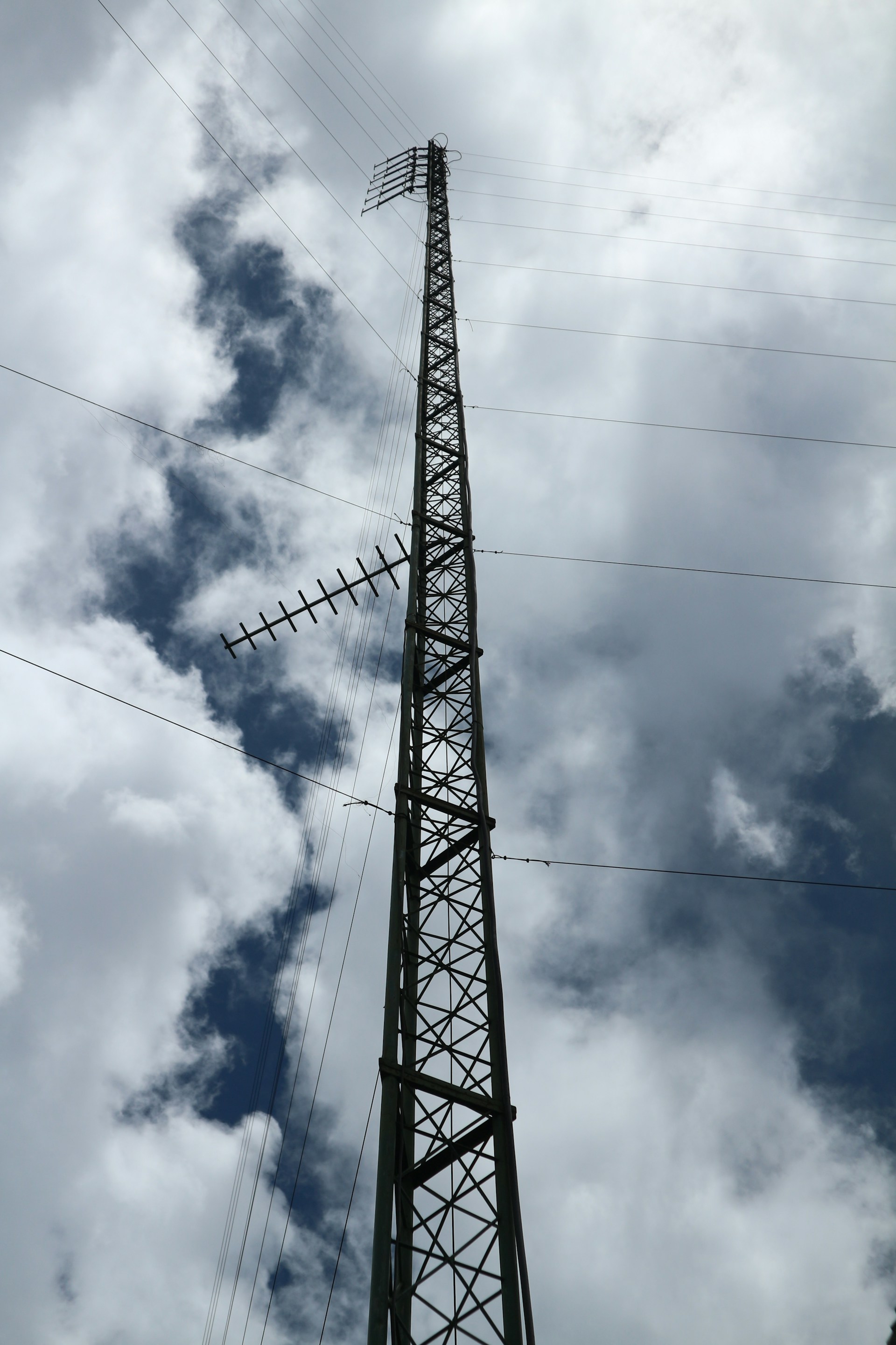 woman wearing yellow long-sleeved dress under white clouds and blue sky during daytime