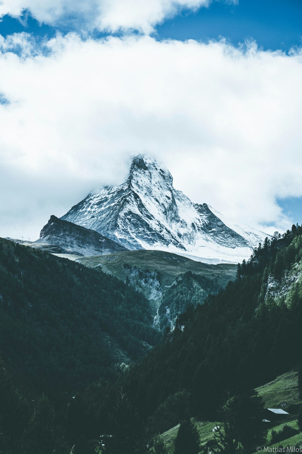 mountain covered by clouds