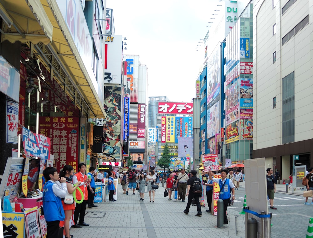 people walking on sidewalk during daytime