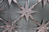 Detailed view of a stainless steel gate with modern geometric patterns