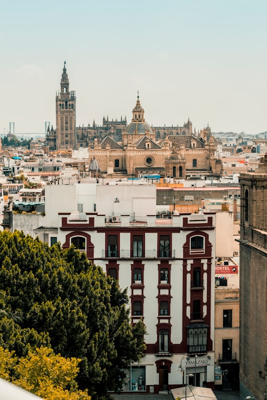 white and red concrete building in Giralda Spain