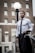 man holding black suit jacket