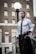 man holding black suit jacket