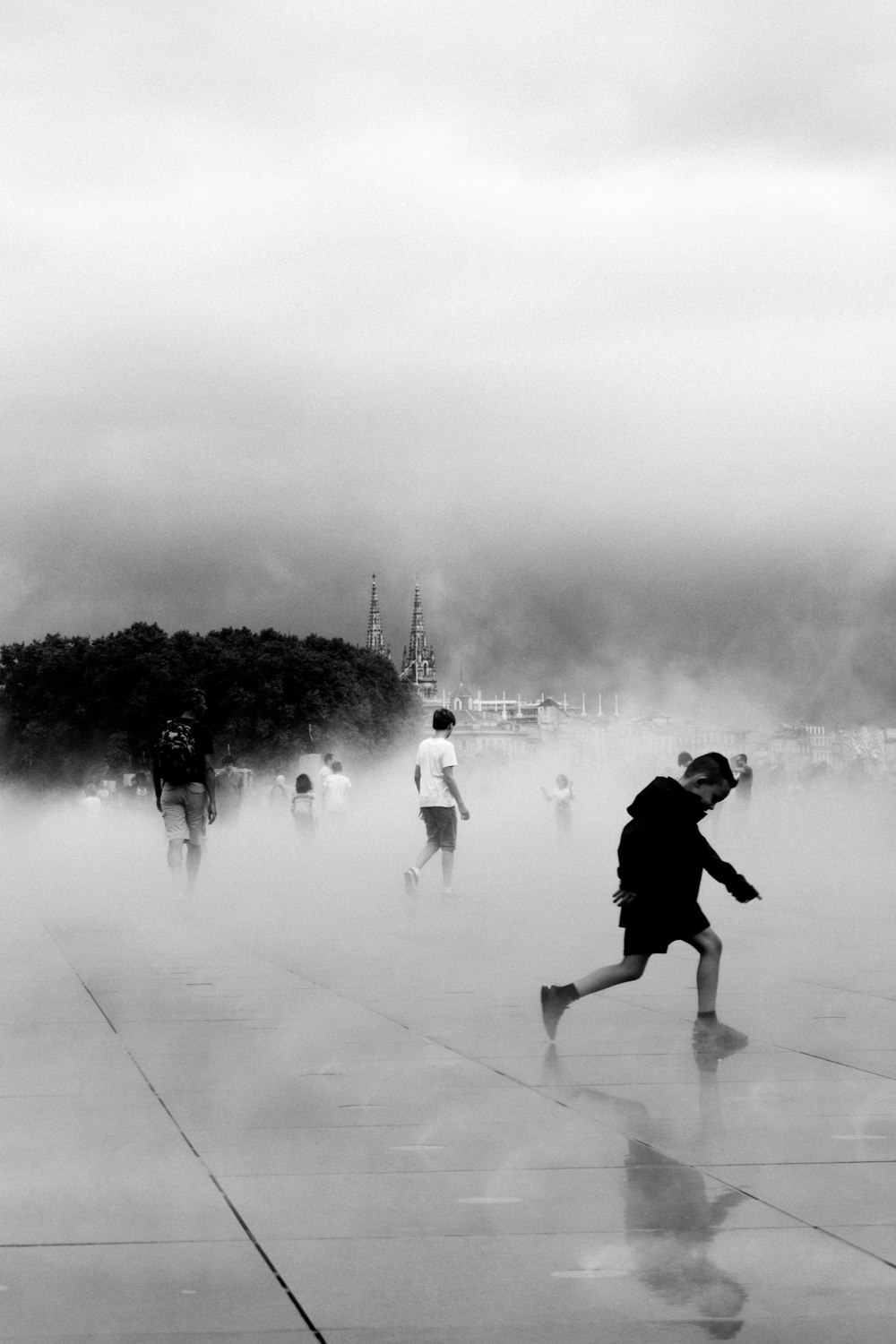 grayscale photo of boy running