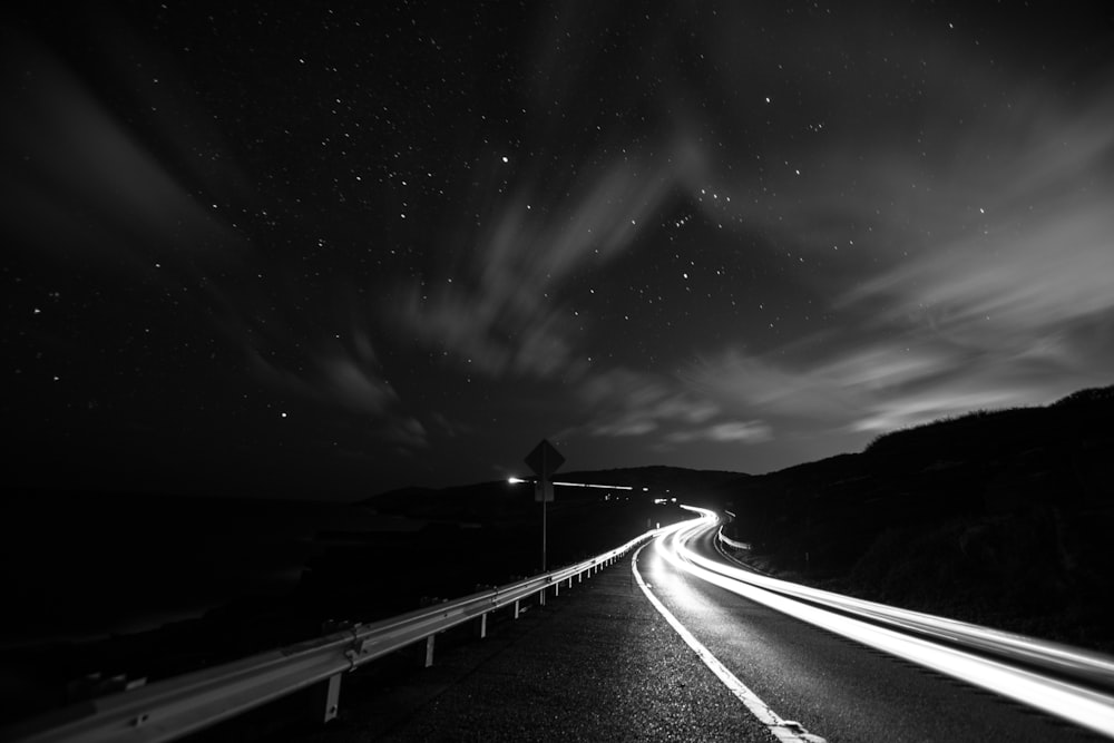 grayscale photography of road during daytime