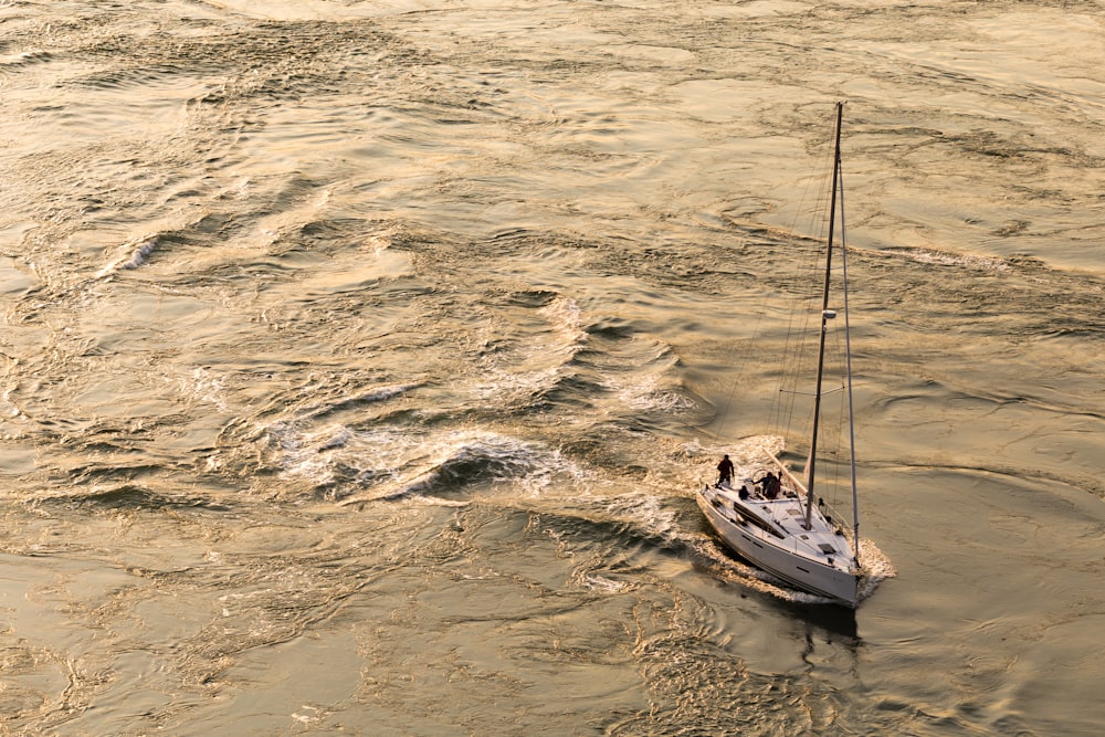 white motorboat on body of water