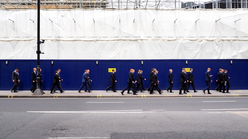 men walking on sidewalk