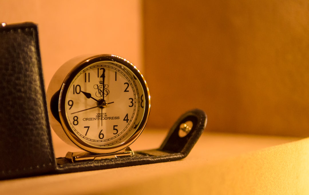white and black table clock,