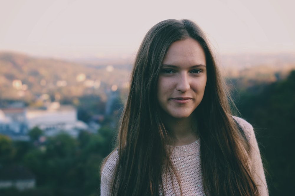 selective focus photography of woman wearing white crew-neck shirt