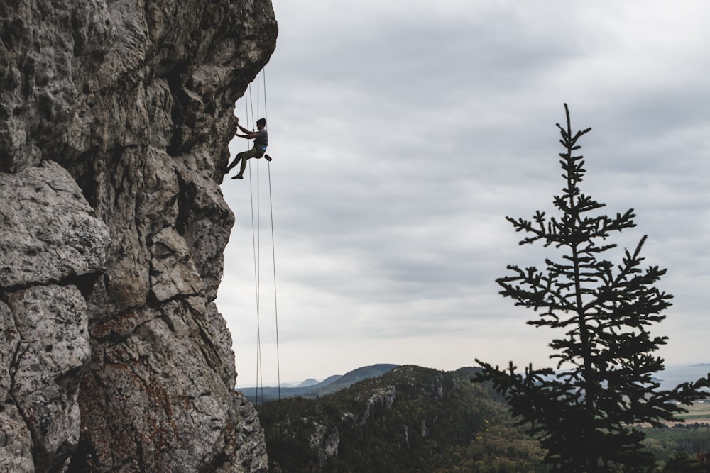 man rock climbing