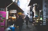 A traveler enjoying a vibrant Korean street market filled with colorful stalls.