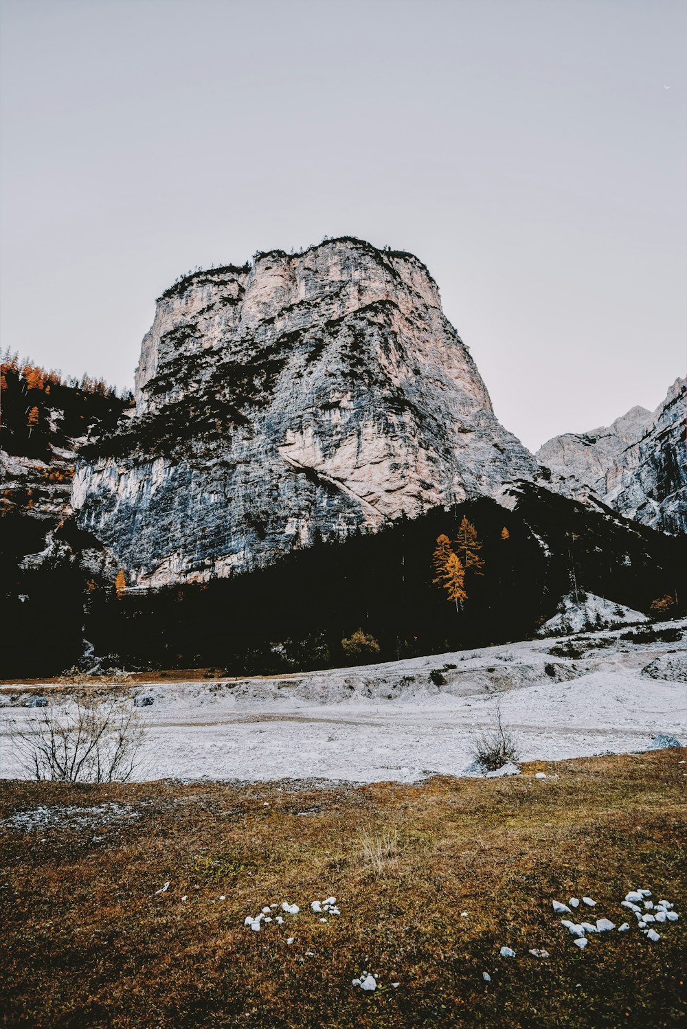 open field near mountain at daytime