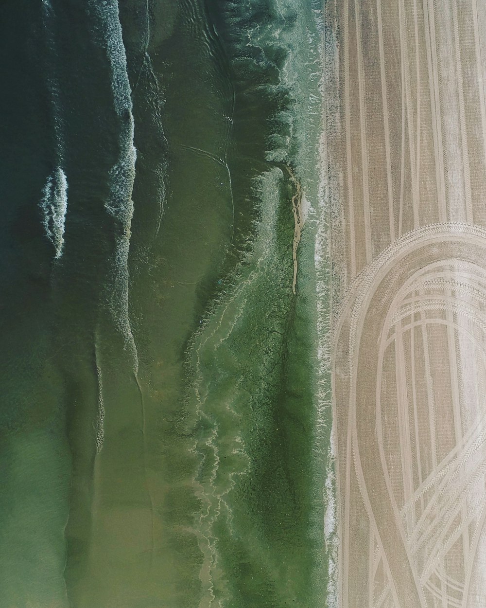aerial photo of soil and body of water