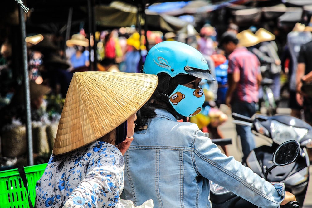 two women riding on motorcycle