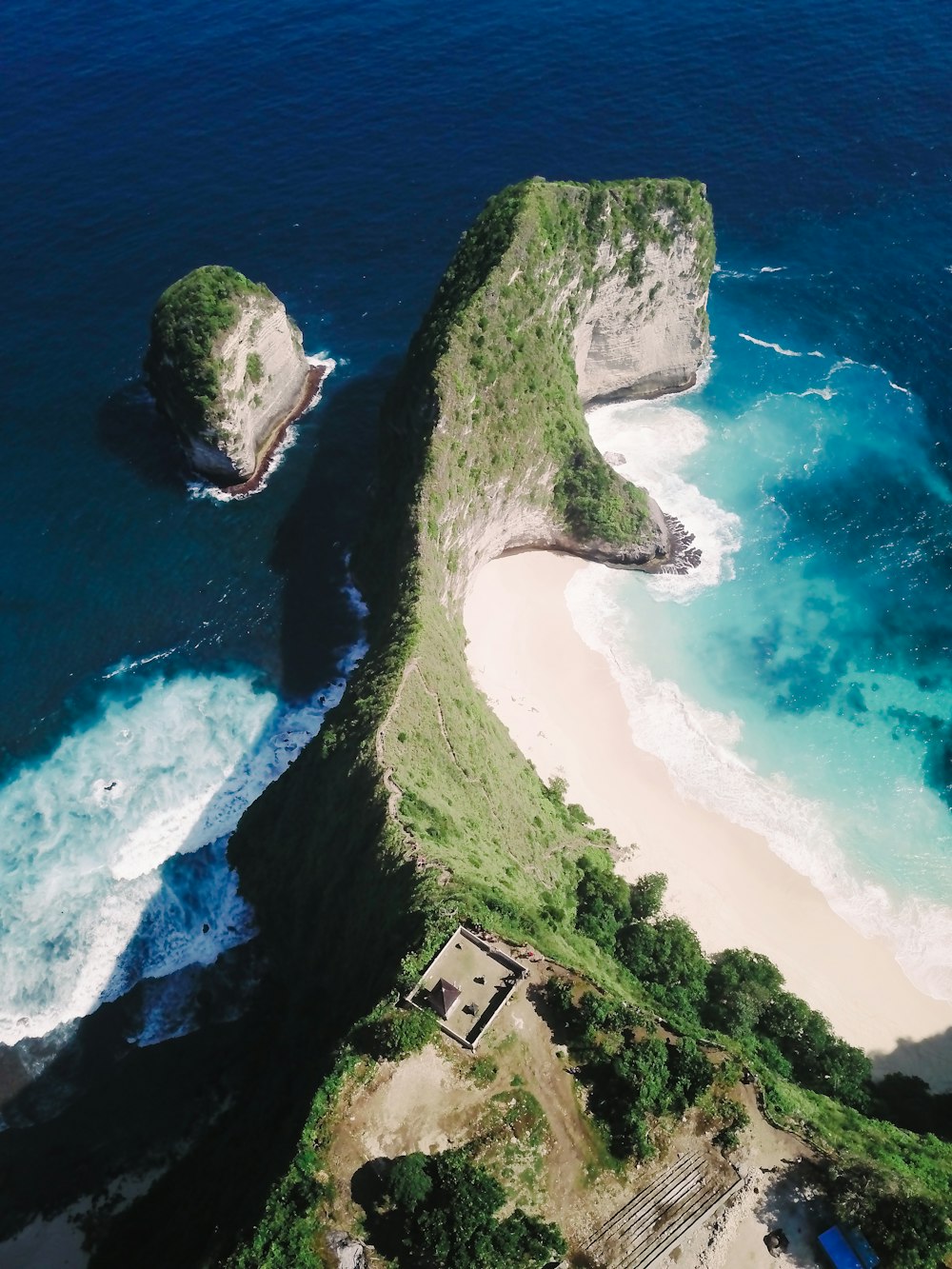 aerial photography of mountain near sea