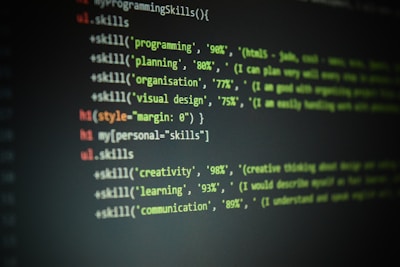 Lines of code are displayed on a dark screen, showing a set of skill percentages related to programming, planning, organization, visual design, creativity, learning, and communication. The text is colored, likely to indicate syntax highlighting in a code editor.
