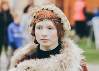 woman wearing red and white fur coat